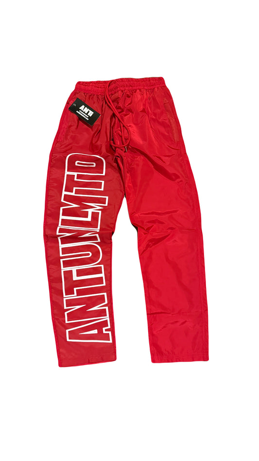 RED NYLON TRACK PANTS
